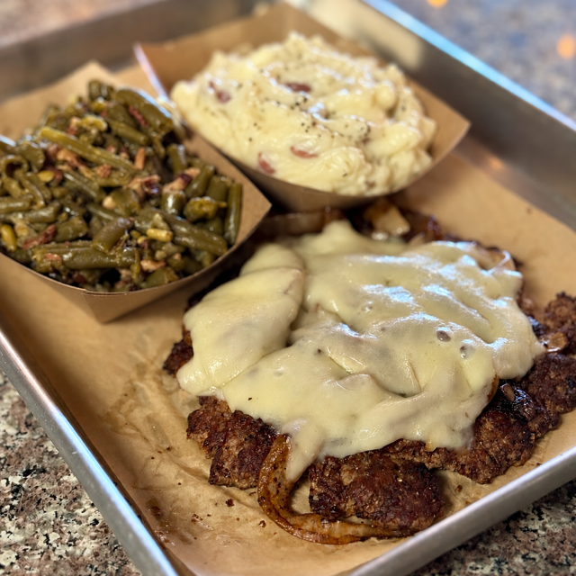 Smother'd Chopped Steak Dinner Special w/ Garlic Mash and Southern Green Beans.